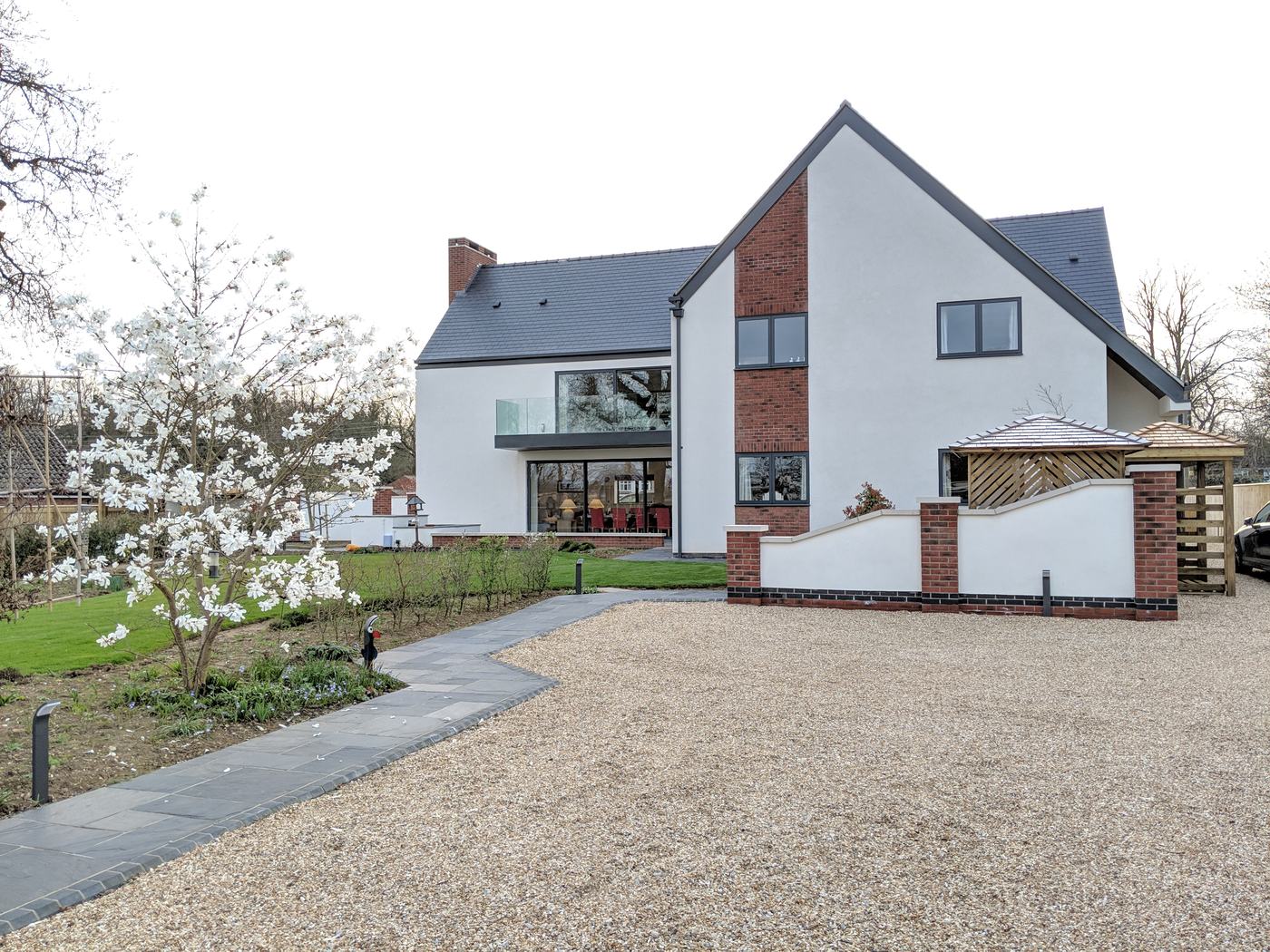 Completed contemporary home in white render and brick
